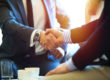 Photo of two businessmen shaking hands.