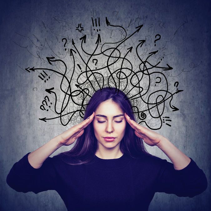 Image of a woman with question marks and arrows over her head to represent cognitive development.