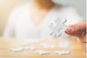 Person doing puzzle for cognitive training services